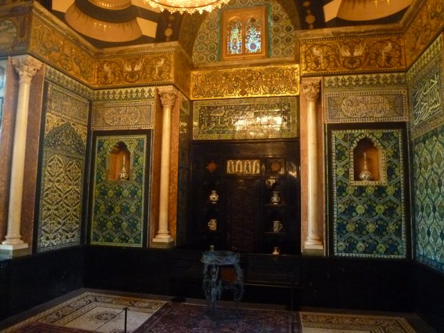 The Arab Hall at Leighton House, its walls lined with Islamic tiles around a central pool
